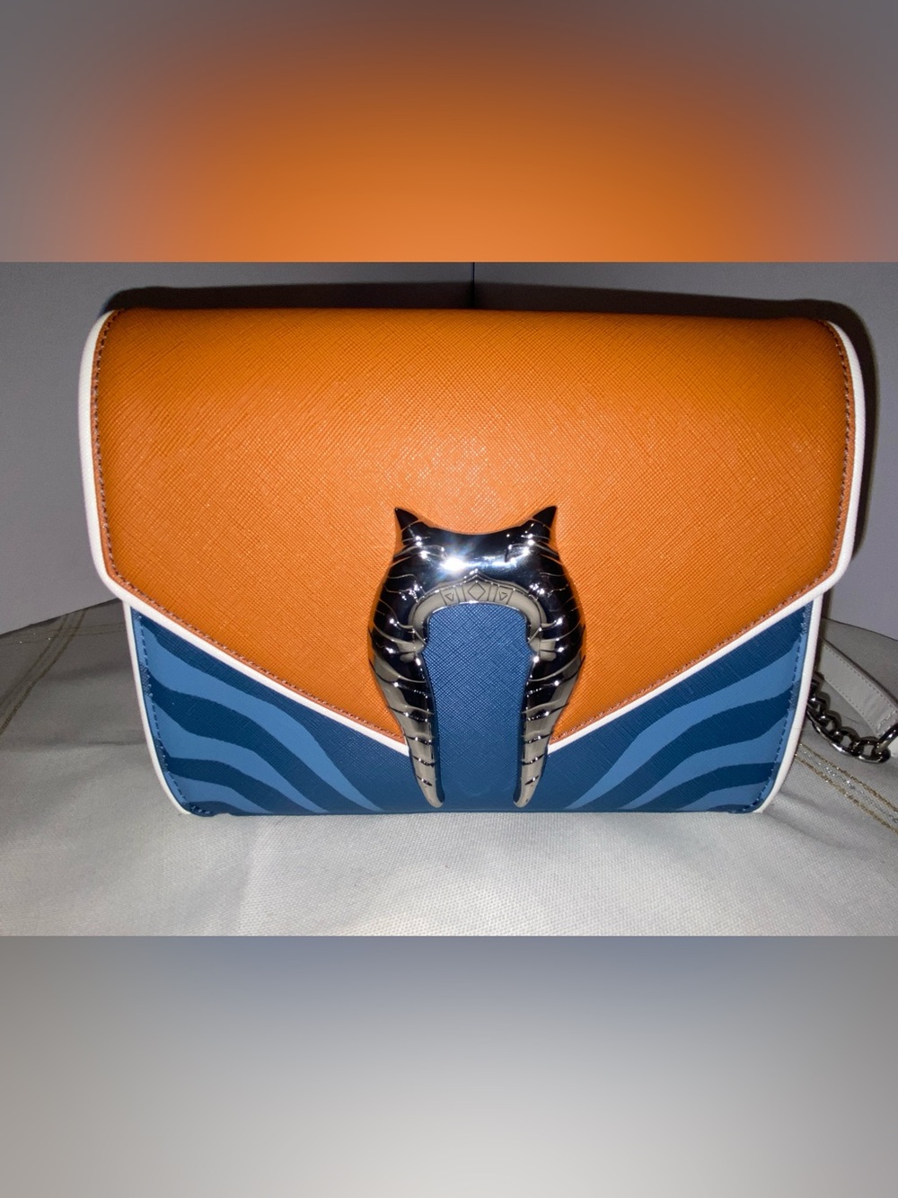 This is a Loungefly The Clone Wars Ahsoka Tano Crossbody Bag.